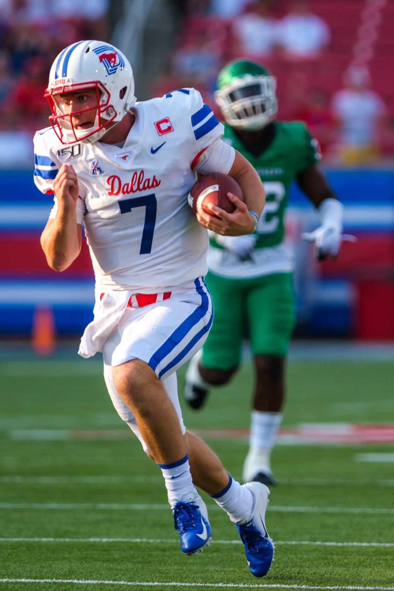 SMU quarterback Shane Buechele (7) during for a first down during the first half of an NCAA...