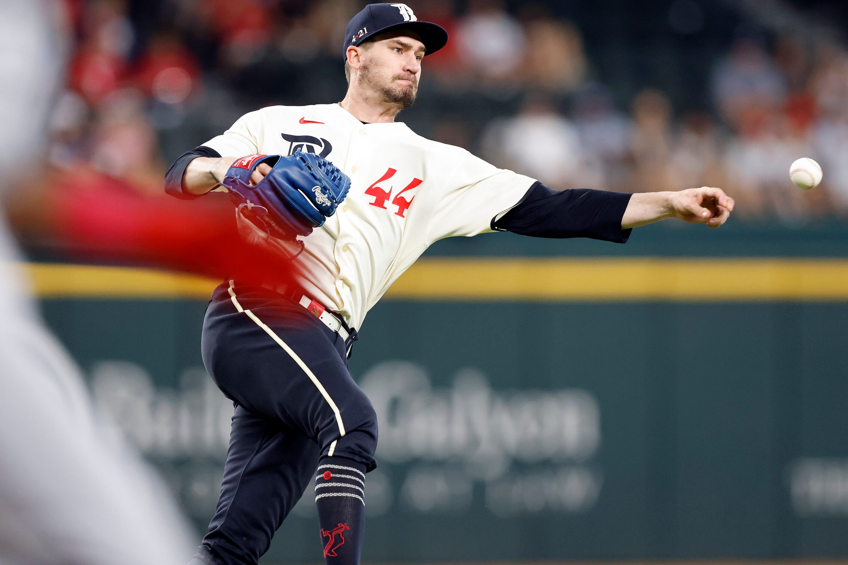 Texas Rangers starting pitcher Andrew Heaney (44) fields a batted ball by Cleveland...