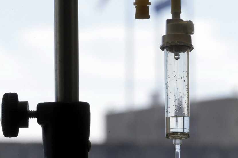  In this Sept. 5, 2013 file photo, an infusion drug to treat cancer is administered to a...