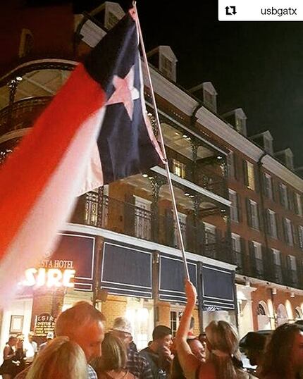 The misaligned Texas flag at the U.S. Bartenders Guild's annual midnight toast in front of...