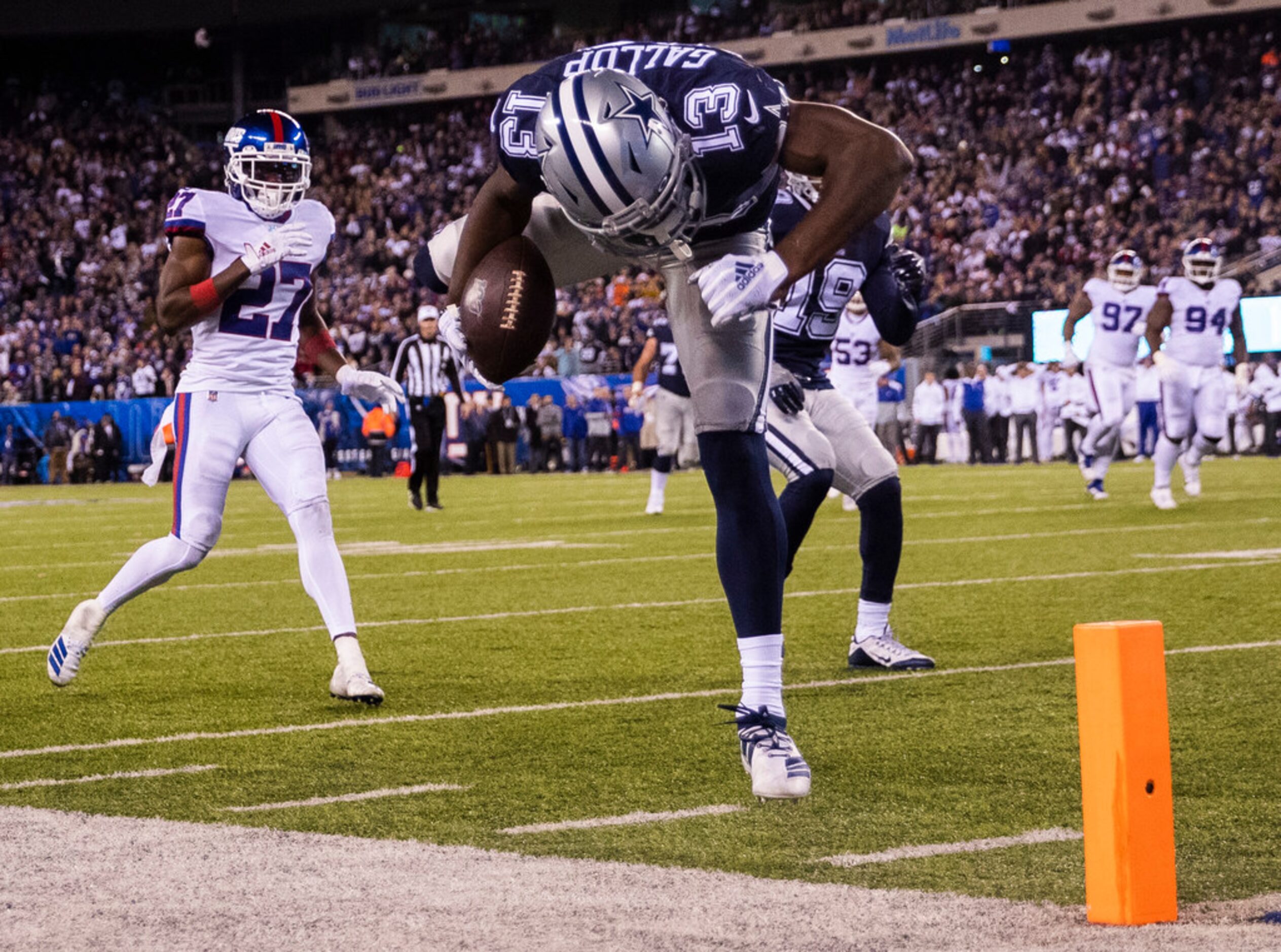 Dallas Cowboys wide receiver Michael Gallup (13) falls across the goal line for a touchdown...