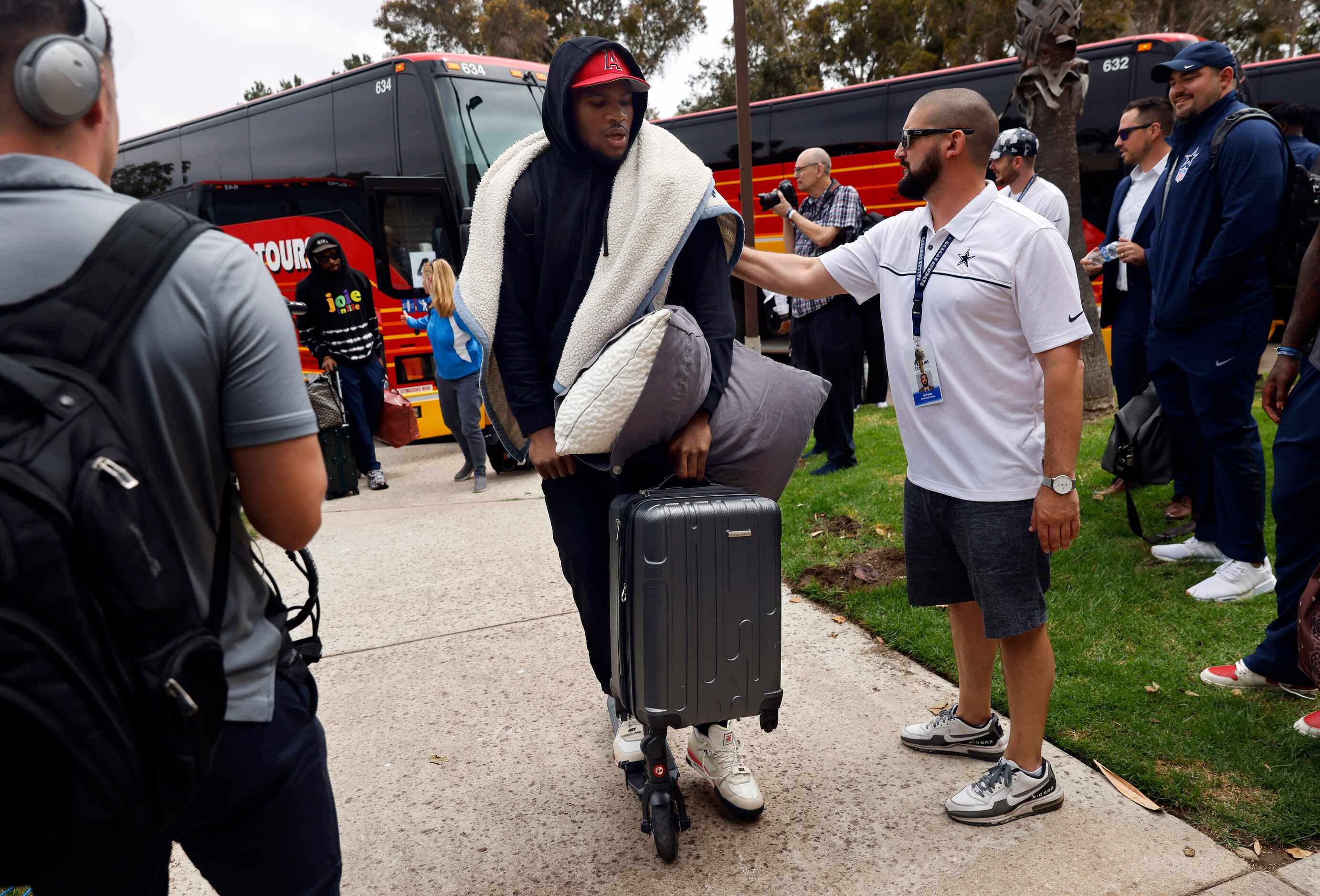 Dallas Cowboys linebacker Micah Parsons arrives on a scooter as he and his teammates arrive...