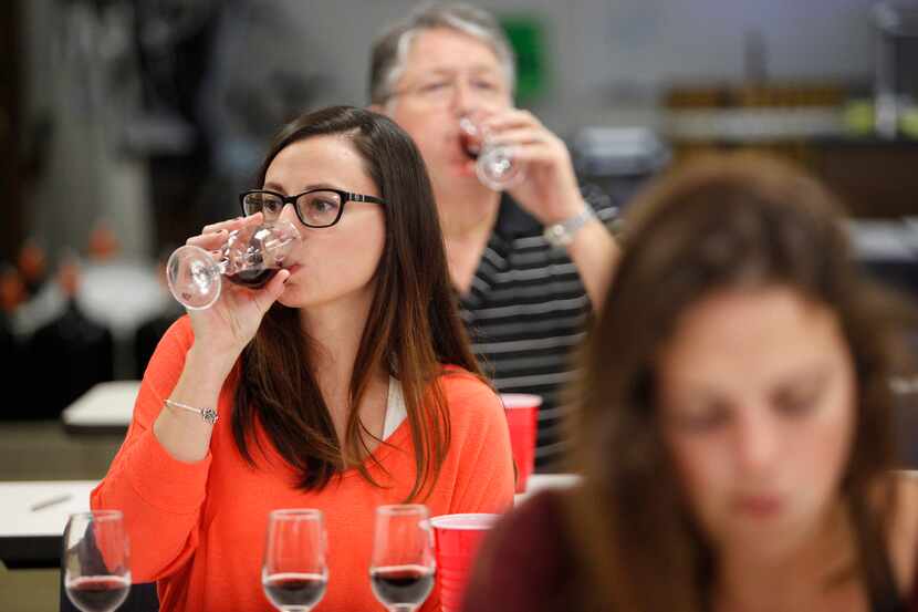 Jamie Robison, 33, of Durant, Oklahoma, tastes wine during an indentification exercise in...