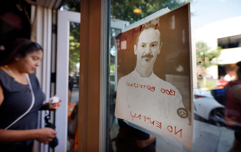 A photo of Carlo Gattini, owner of Botolino, was placed in the front window of Azucar in Oak...