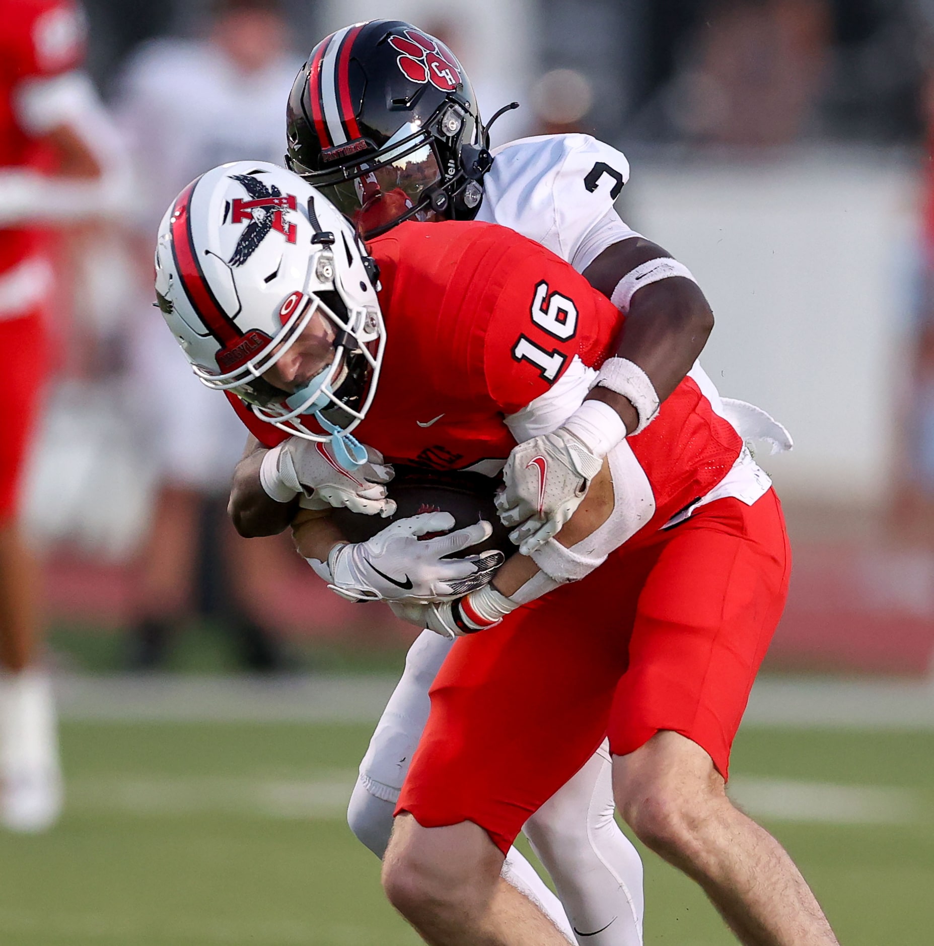 Argyle wide receiver Grant Romero (16) fights for yardage against Colleyville Heritage...