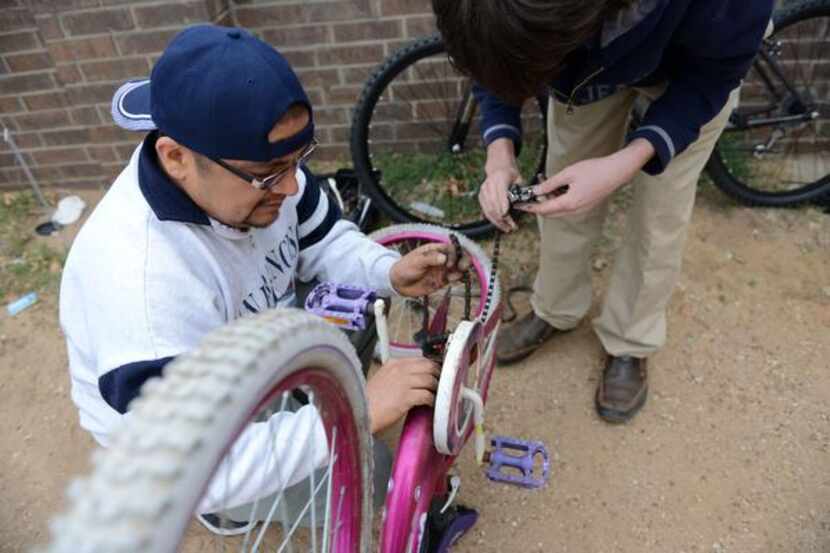 
Armando Ramirez fixes a donated, used bike for his daughter during a “Wrench Day” as part...