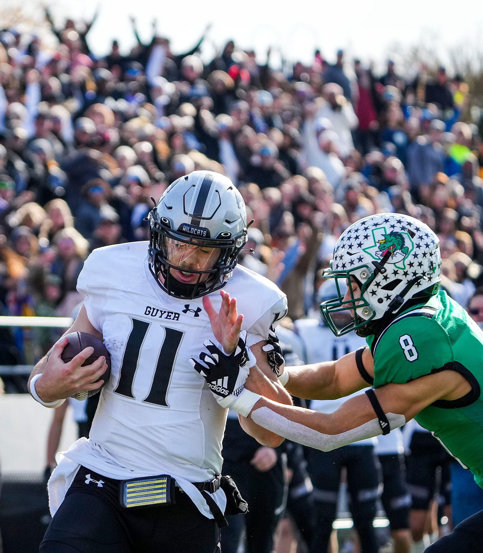 Denton Guyer quarterback Jackson Arnold (11) gets past Southlake Carroll defensive back...