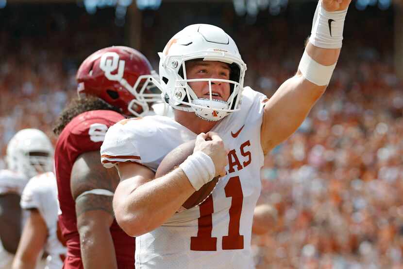 Texas Longhorns quarterback Sam Ehlinger (11) celebrates after rushing for a touchdown in a...