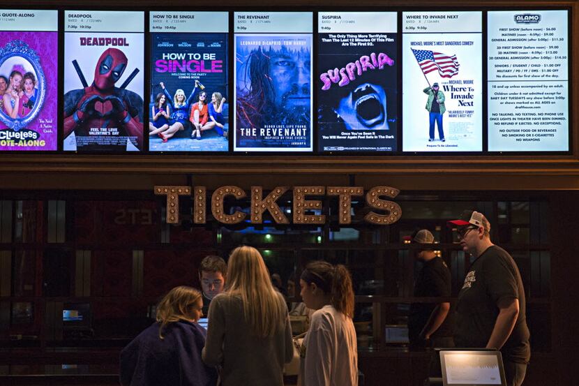 Patrons purchase movie tickets at the new Alamo Drafthouse location February 17, 2016 in...