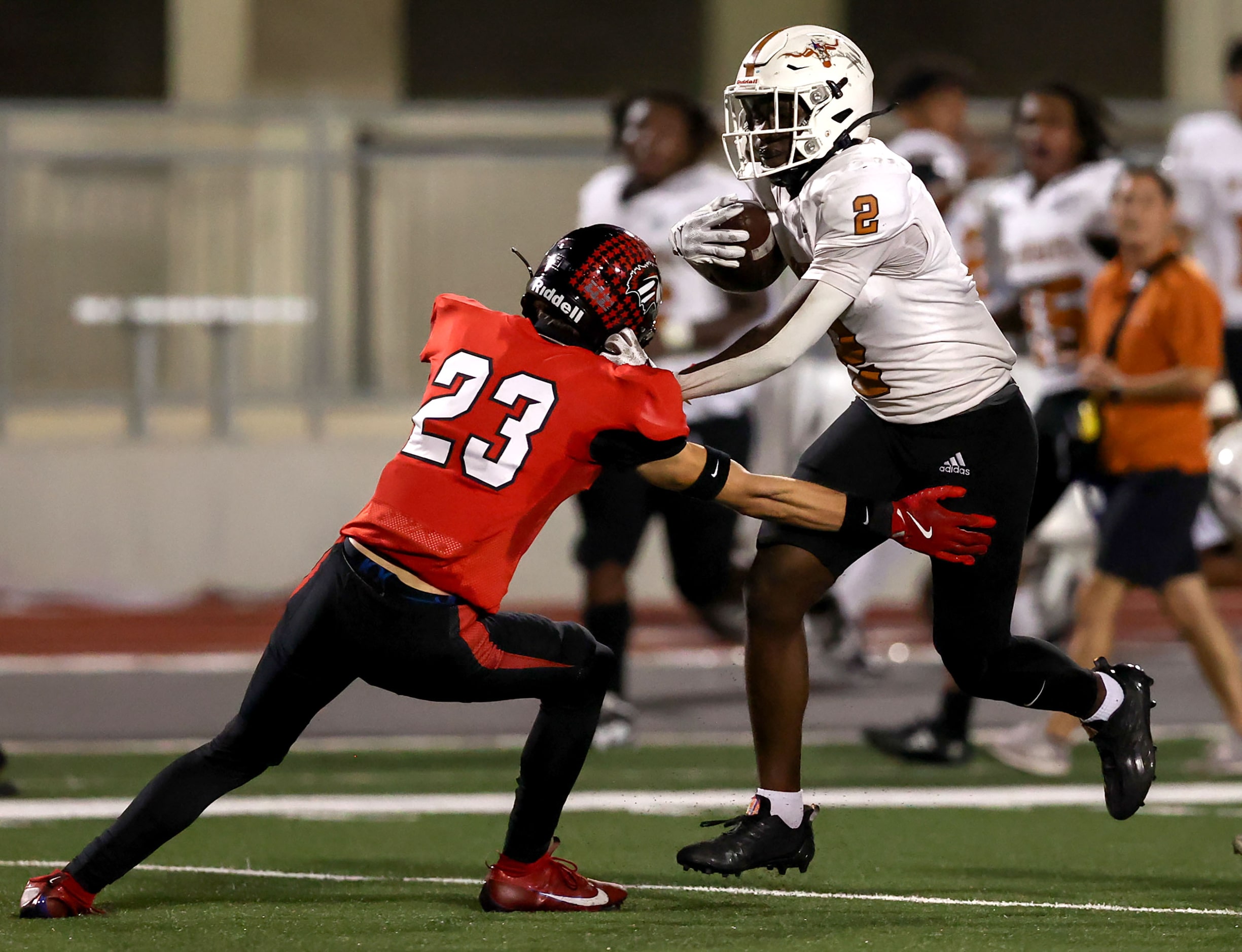 W.T. White running back Ben Ebeke (2) tries to run over Creekview defensive back Jude Marlin...