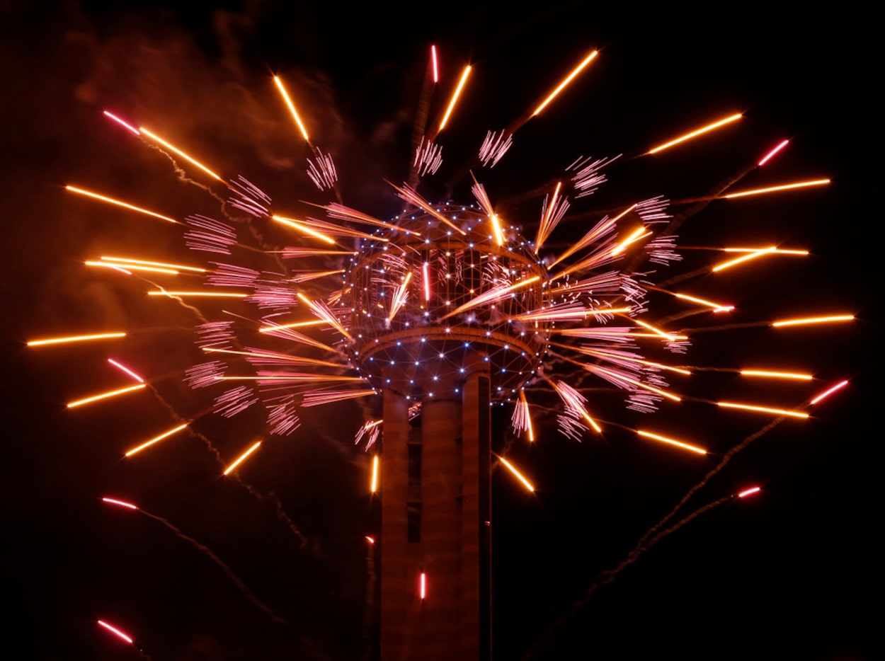 Fireworks fly from Reunion Tower during the New Year's Eve event in Dallas on Dec. 31, 2016. 