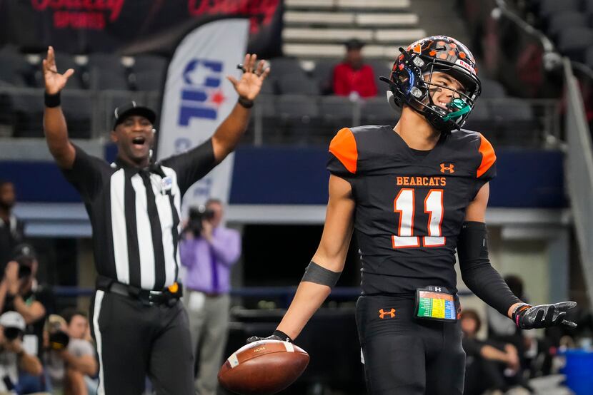 Aledo wide receiver Jalen Pope (11) reacts after catching a touchdown pass during the first...