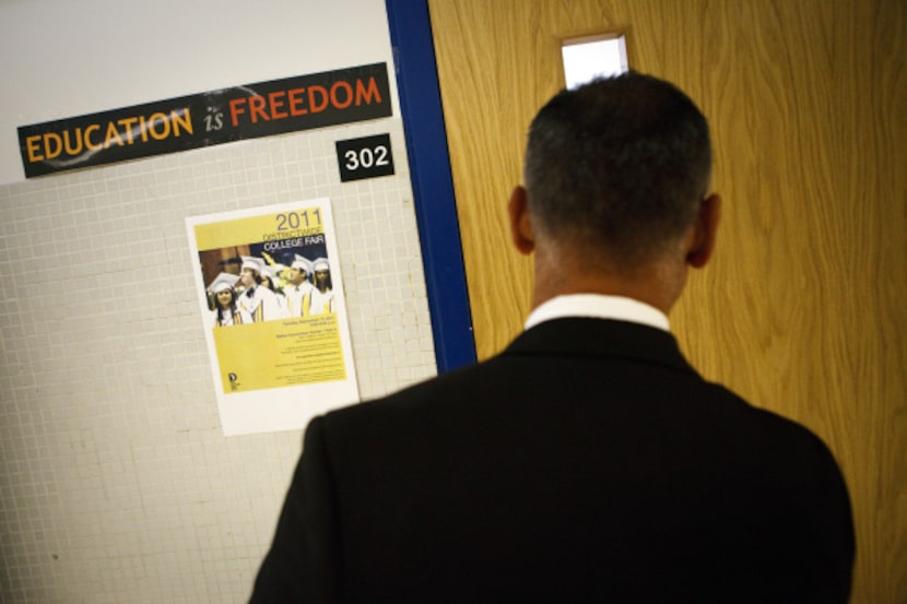 Principal Rawly Sanchez peeked in the window to the college and career room at Spruce High...