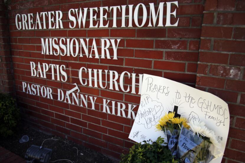 Memorials were left in front of the church after Monday's slaying.
