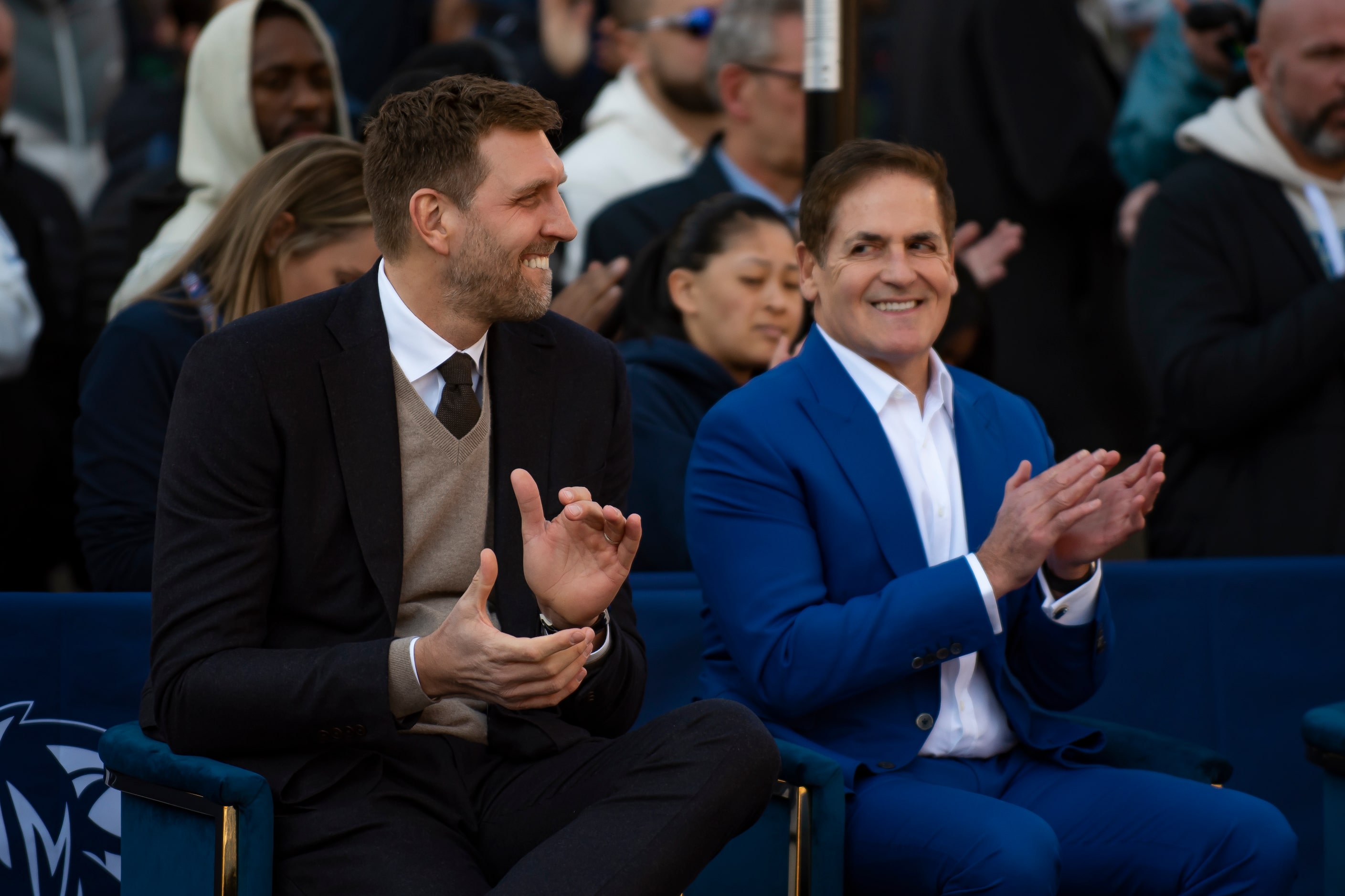 Dirk Nowitzki smiles while sitting next to Dallas Mavericks owner Mark Cuban during the "All...