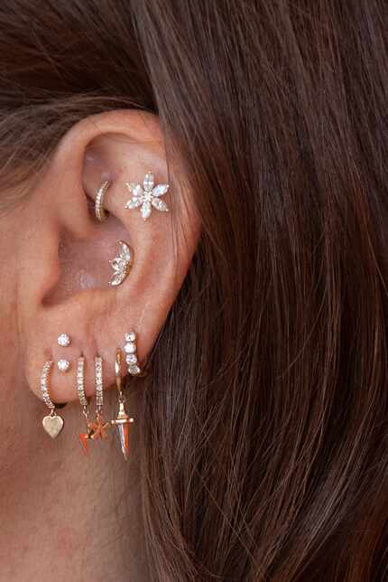 Alysa Teichman, owner of Wildlike, sports a variety of earrings on her left ear.