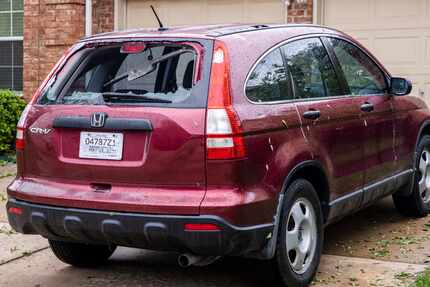 A vehicle sustained significant window damage in a severe hailstorm overnight in Keller,...