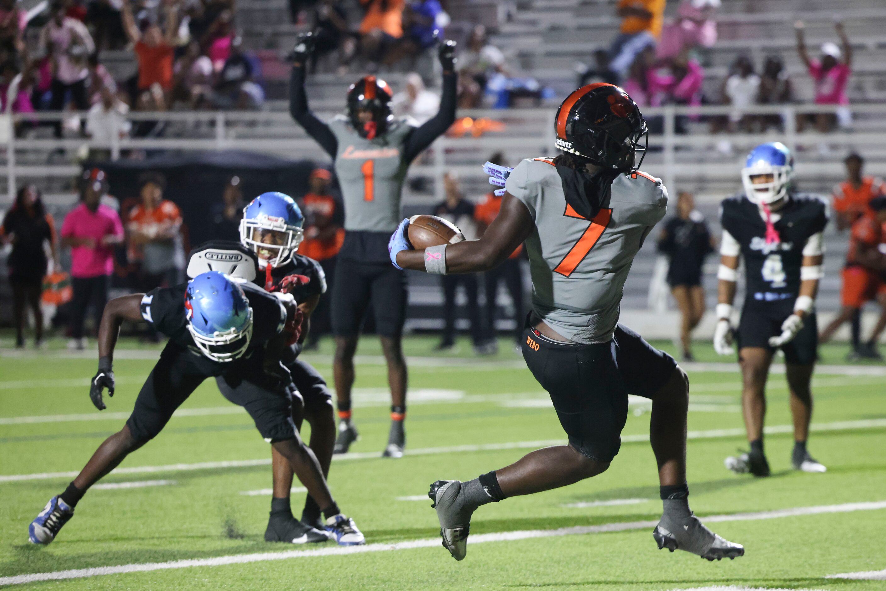 Lancaster High’s Dakeriean Johnson (7) scores a touchdown during the second half of a...