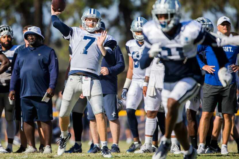 Cowboys quarterback Cooper Rush (7) attempts a pass during an afternoon practice at training...