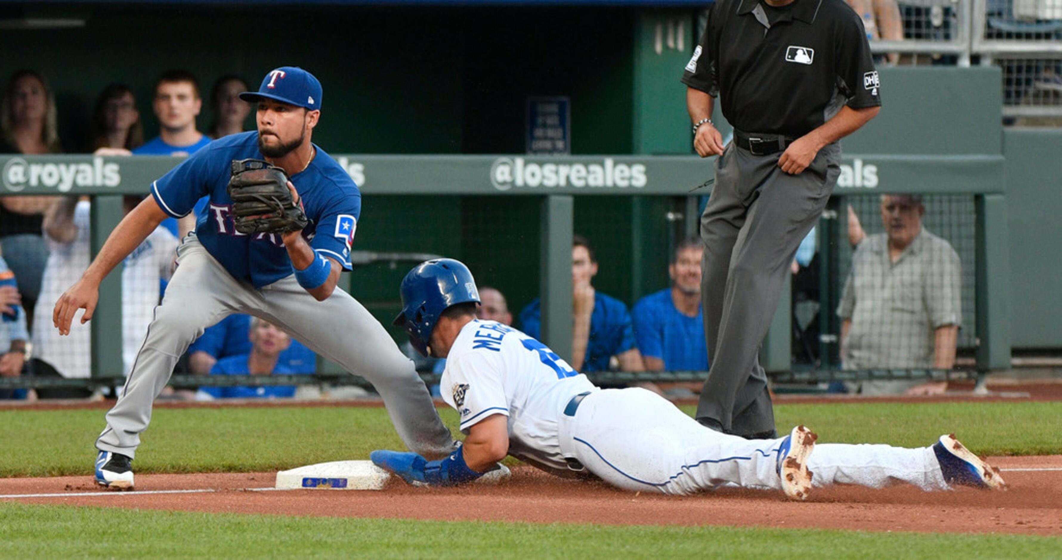 KANSAS CITY, MO - JUNE 19: Whit Merrifield #15 of the Kansas City Royals slides into third...