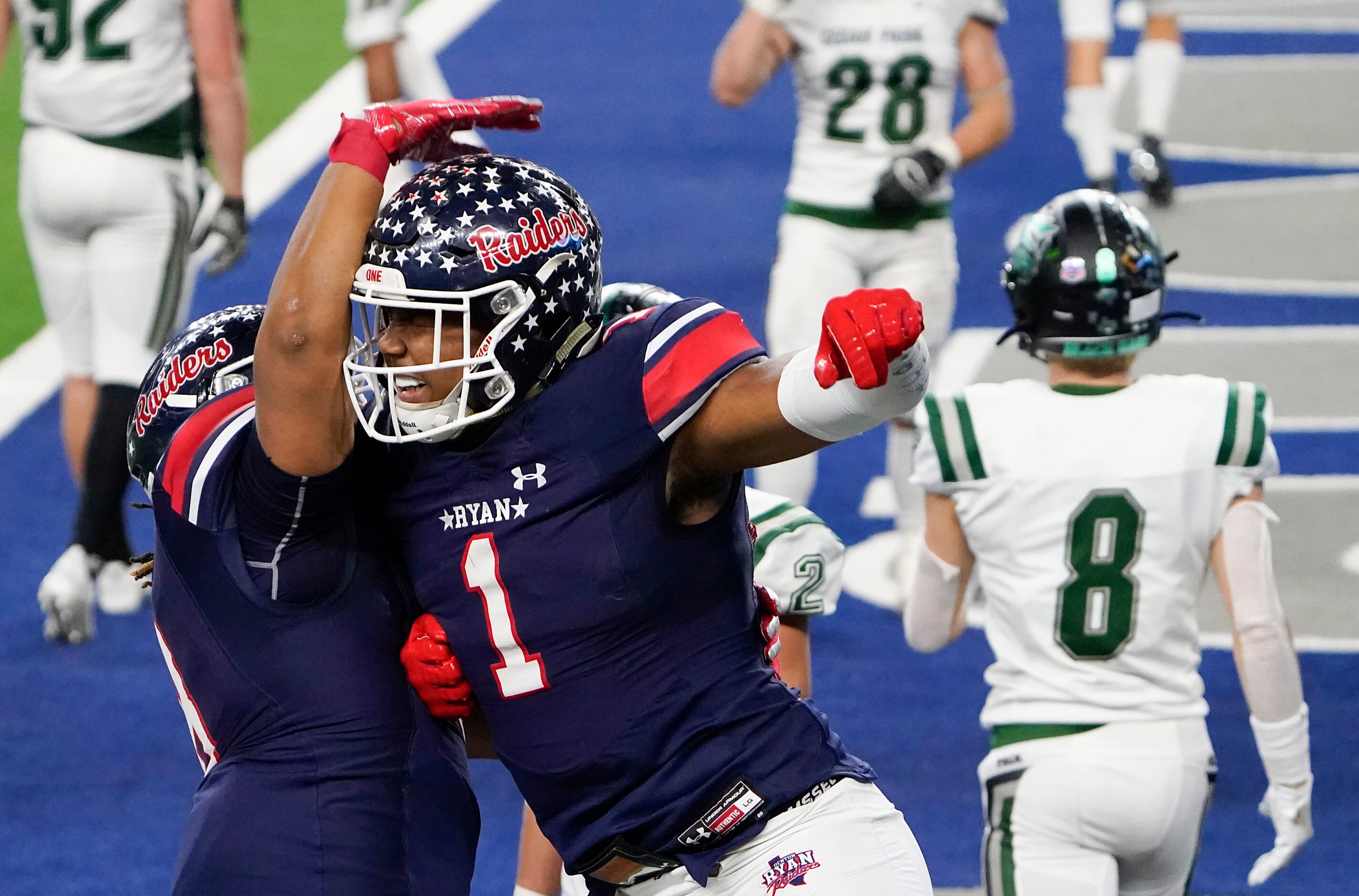 Denton Ryan wide receiver Ja'Tavion Sanders (1) celebrates with teammate Jay Sheppard (8)...