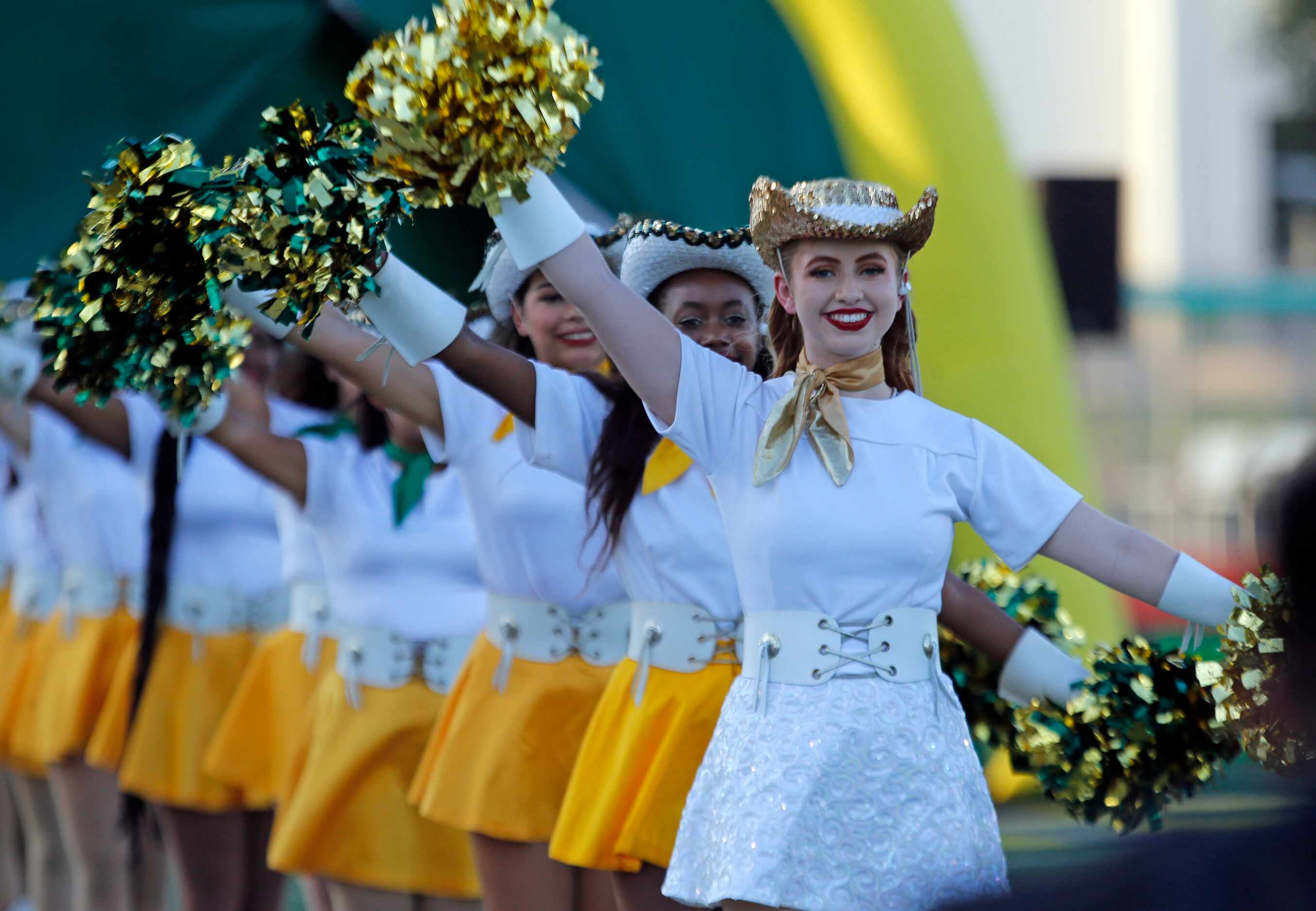 The Newman Smith high drill team performs a routine before the first half of a high school...