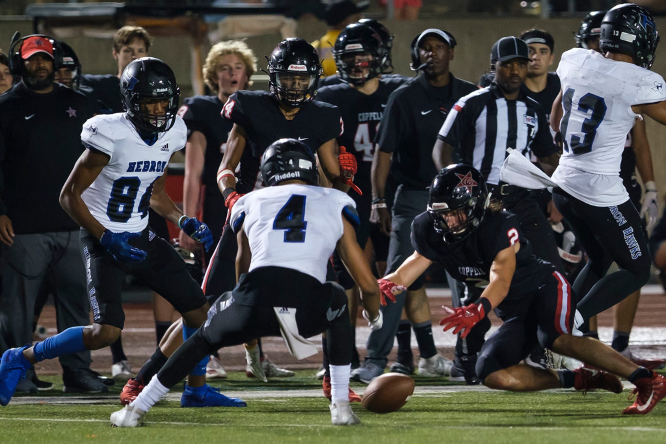 CoppellÃs Jan Rivera (2) and HebronÃs Donovan Tubbs (4) scramble to recover an onside kick...