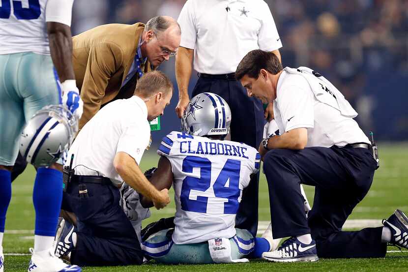 The Dallas Cowboys medical staff sees to cornerback Morris Claiborne's (24) injury in the...