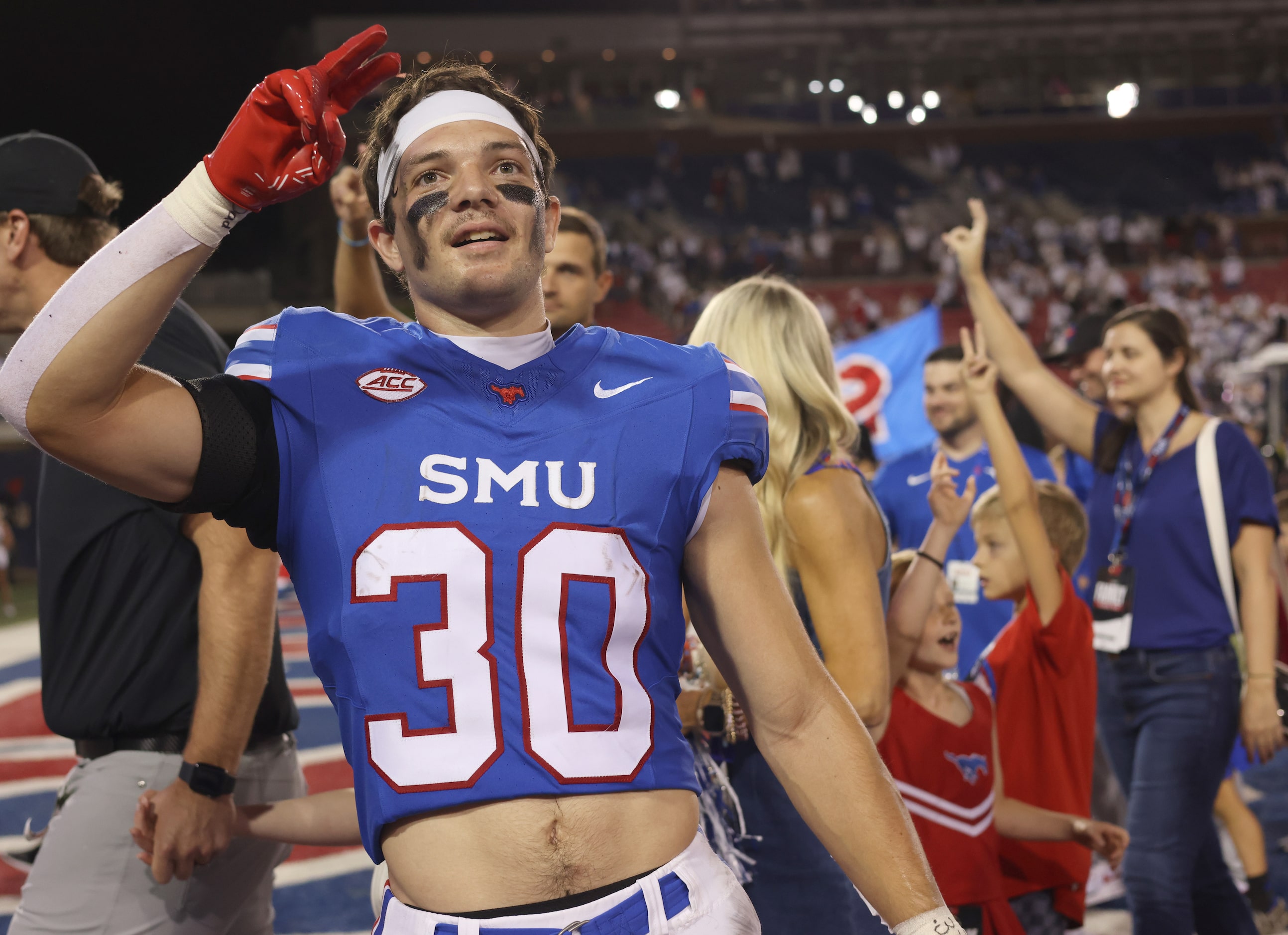 SMU Mustangs receiver Carter Campbell (30) pauses as the SMU band plays the school song...