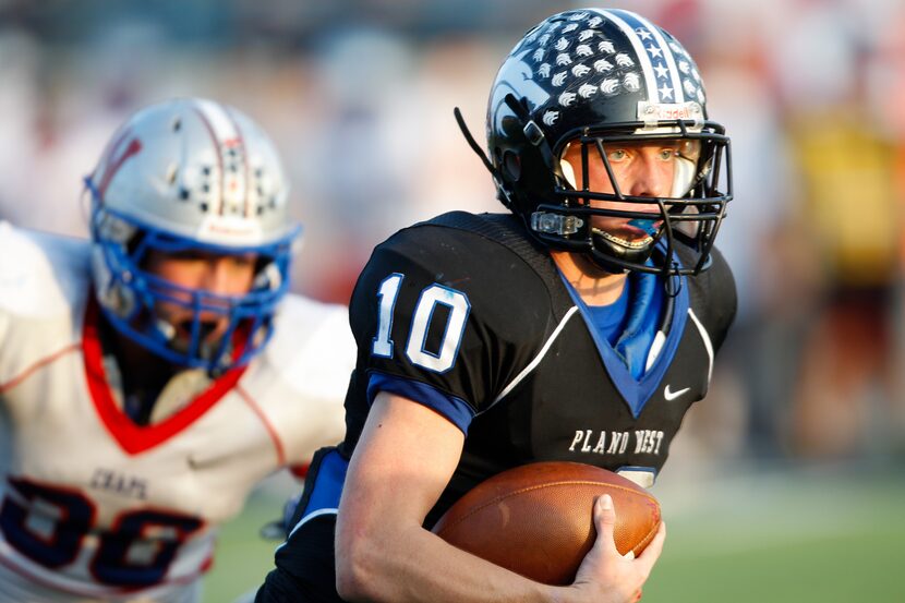 Plano West's Travis Korry (10) scrambles against the Austin Westlake defense in the Class 5A...