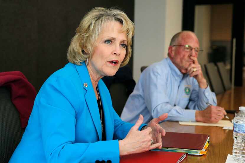 Rep. Cindy Burkett, R-Sunnyvale answers questions as State Sen. Bob Hall, R-Edgewood listens...