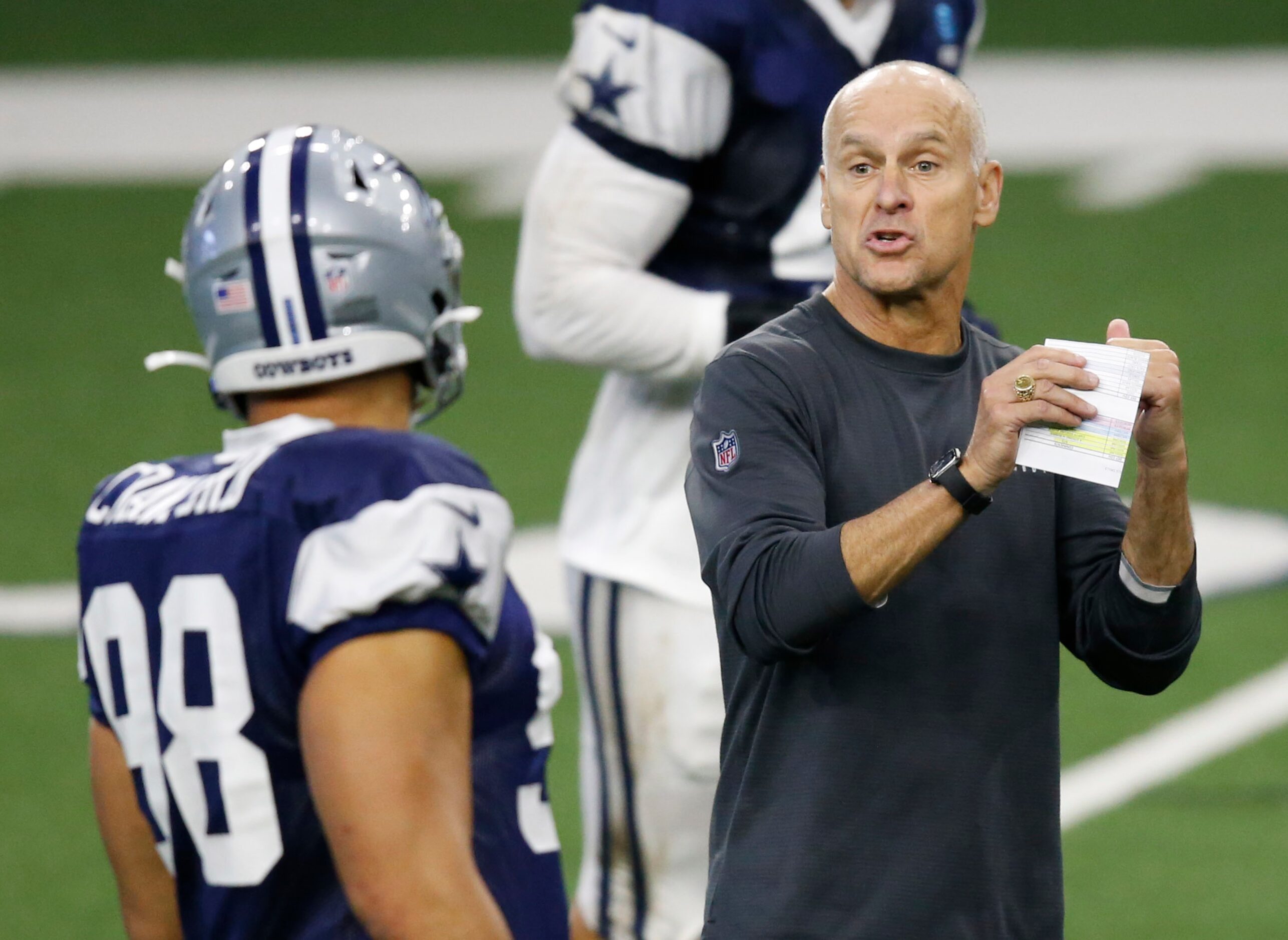 Dallas Cowboys defensive coordinator Mike Nolan talks with Dallas Cowboys defensive end...