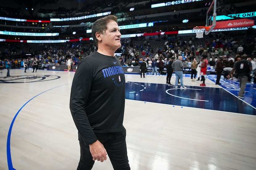 Dallas Mavericks owner Mark Cuban leaves the court after a loss to the Chicago Bulls in an...