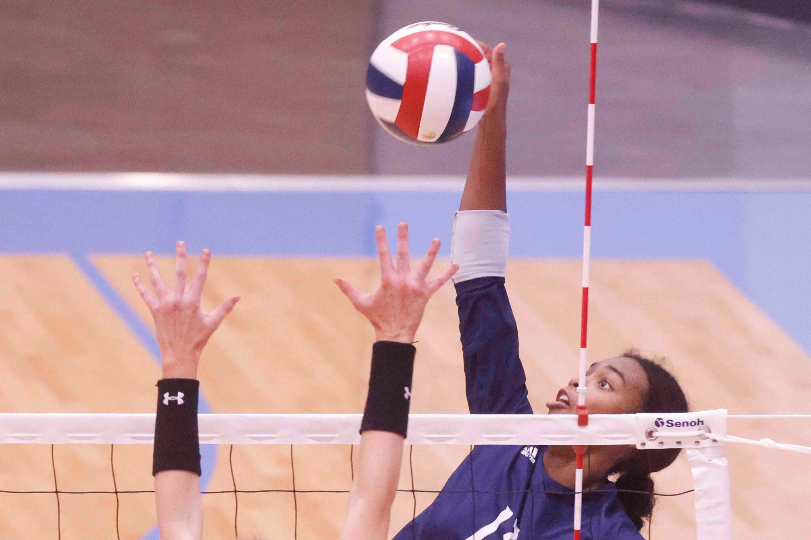 Flower Mound’s Brianna Watson (13) spikes against Highland Park High during a volleyball...