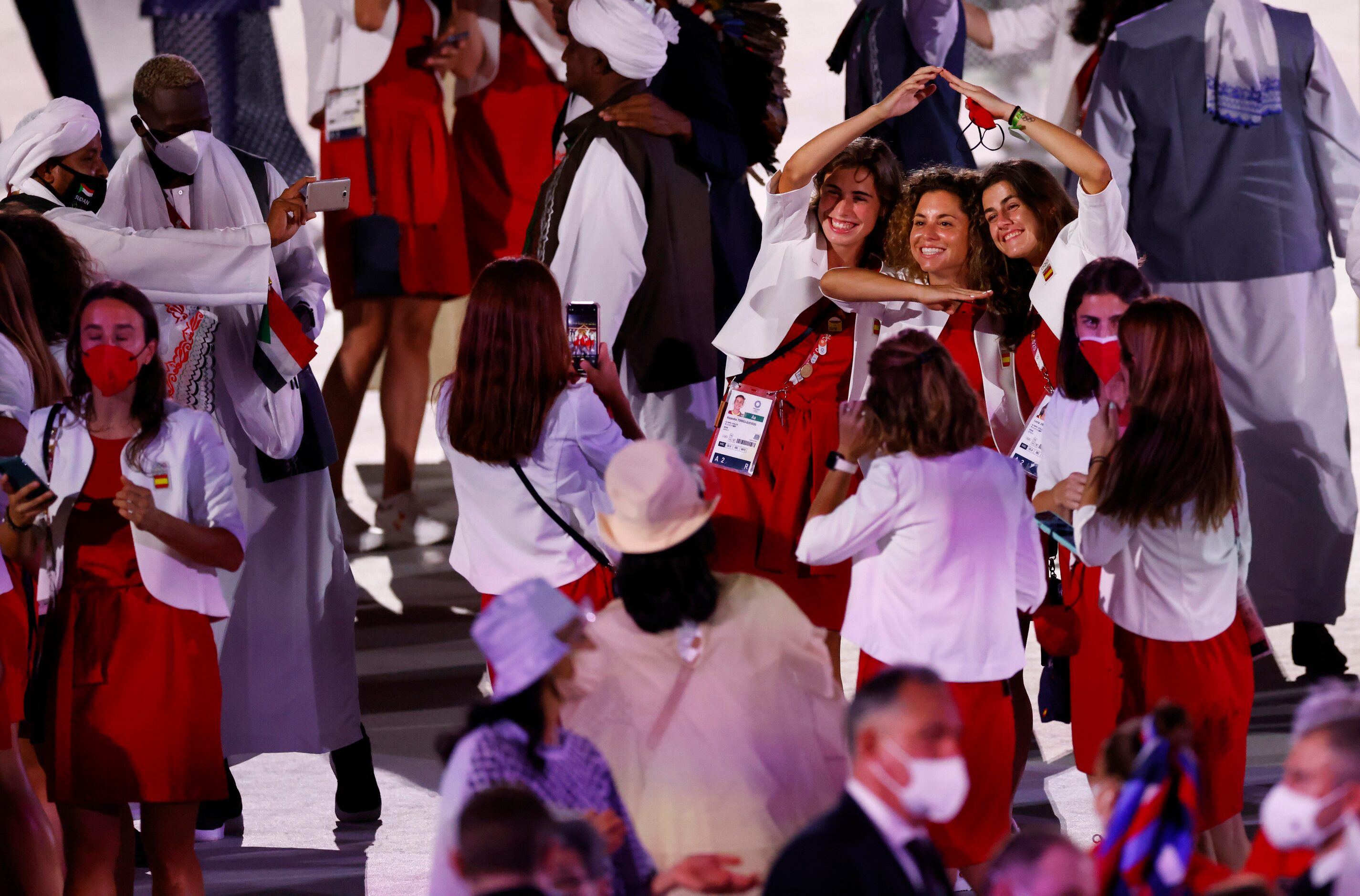 Spain’s olympic athletes pose for a photo as teams are introduced during the opening...