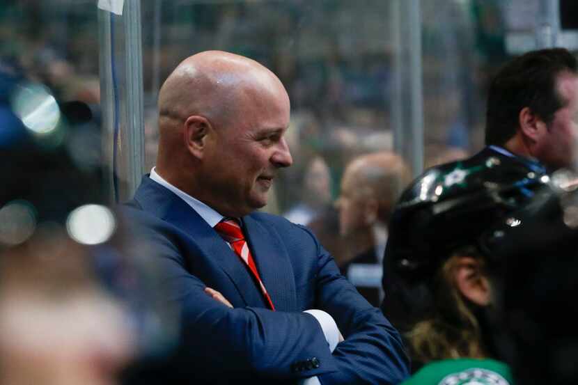 Dallas Stars head coach Jim Montgomery watches during the second period of a preseason NHL...