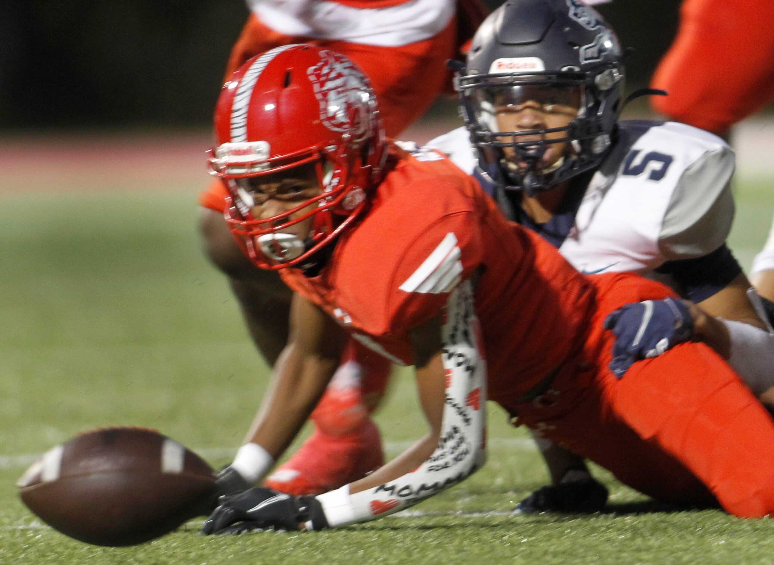 Terrell's Chase Frazier (3) eyes the ball after being hit by Carrollton Ranchview defender...