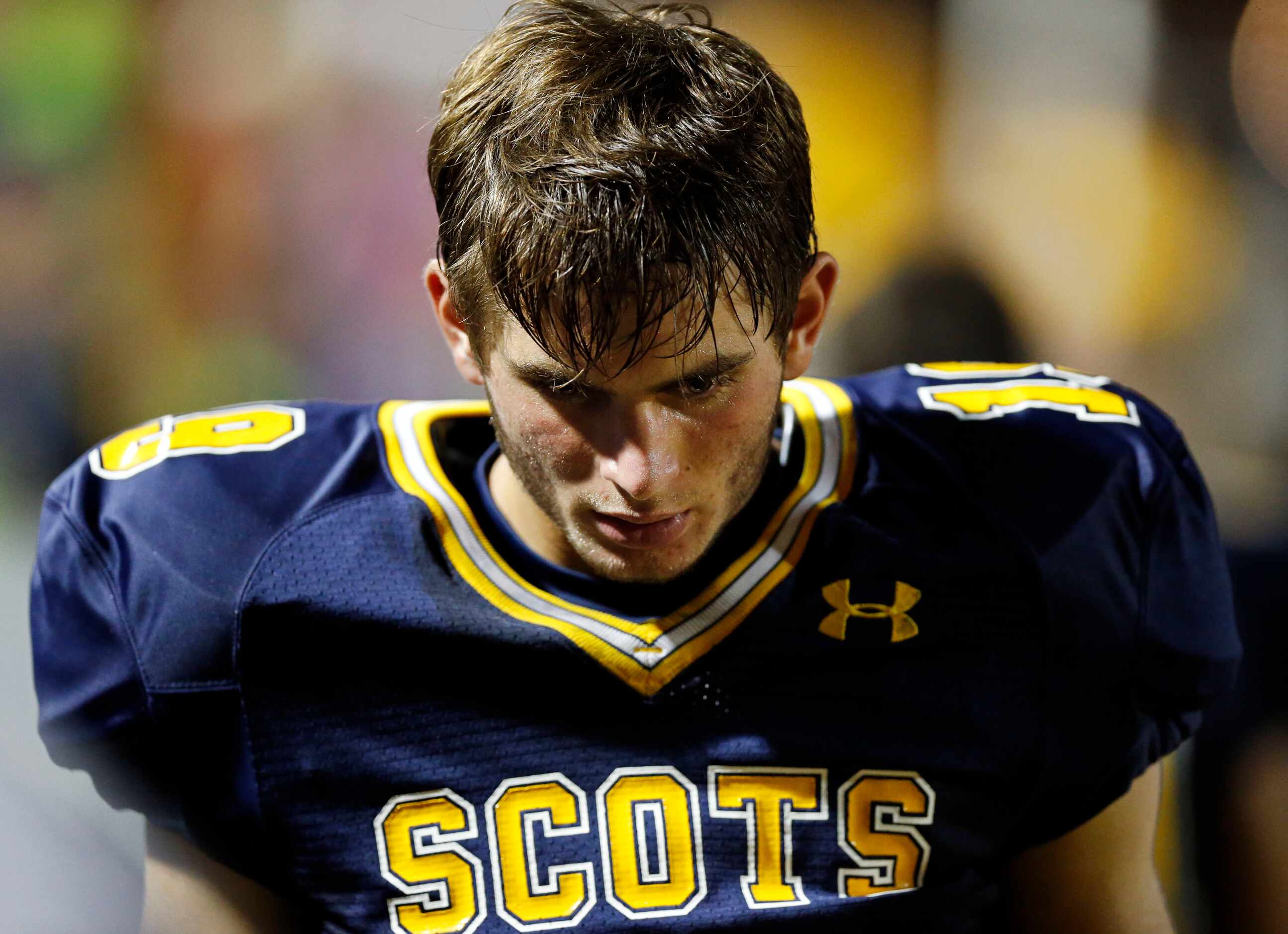 Highland Park receiver J.T. Dooley looks down as the Scots trail far behind Pulaski during...