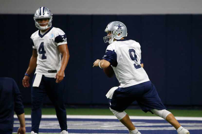 Cowboys quarterback Dak Prescott (4) watches quarterback Tony Romo (9) during practice at...