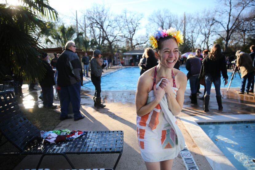 Erin Brandao gets warm in a towel after participating in the fifth annual Hypnotic Donuts...