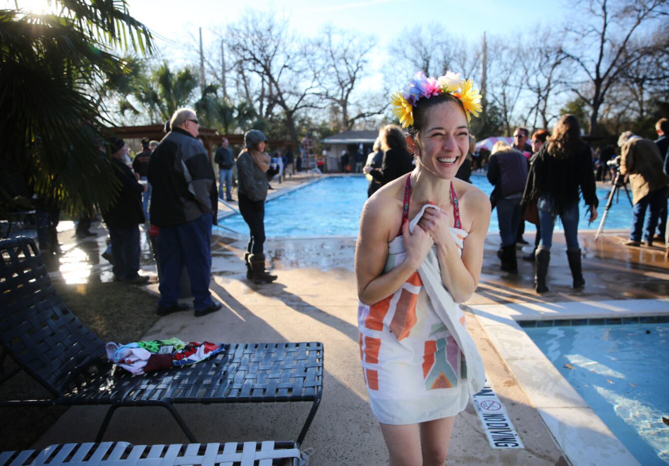 Erin Brandao gets warm in a towel after participating in the fifth annual Hypnotic Donuts...
