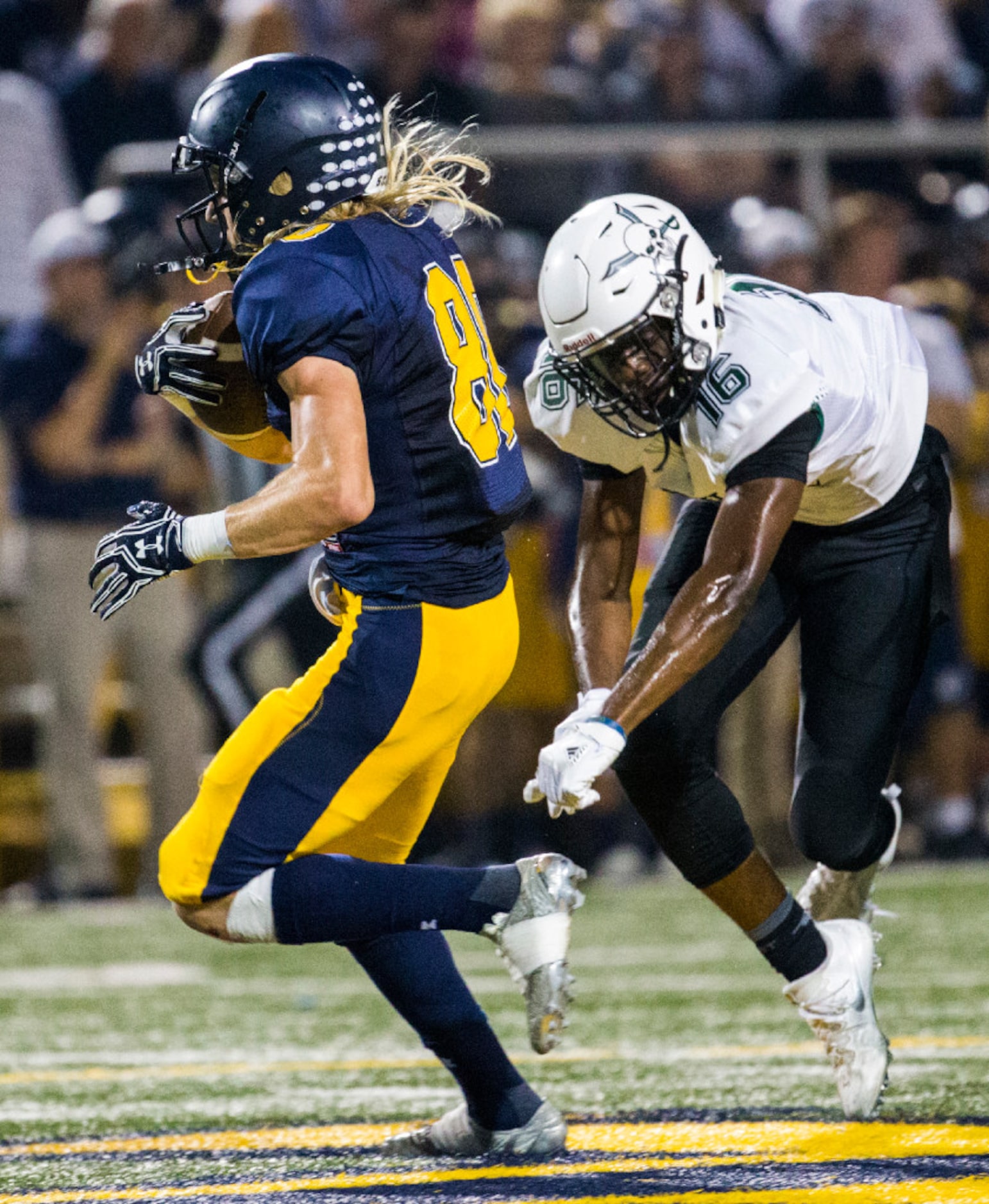 Highland Park wide receiver Hudson Wood (80) gets away from Mesquite Poteet defensive back...