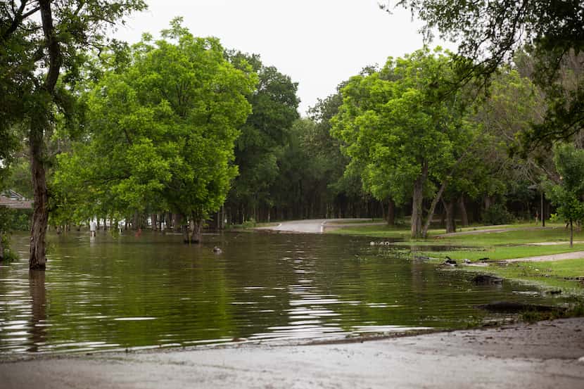 The flooded Camp Site B road at Loyd Park on Friday, May 28, 2021, in Grand Prairie.