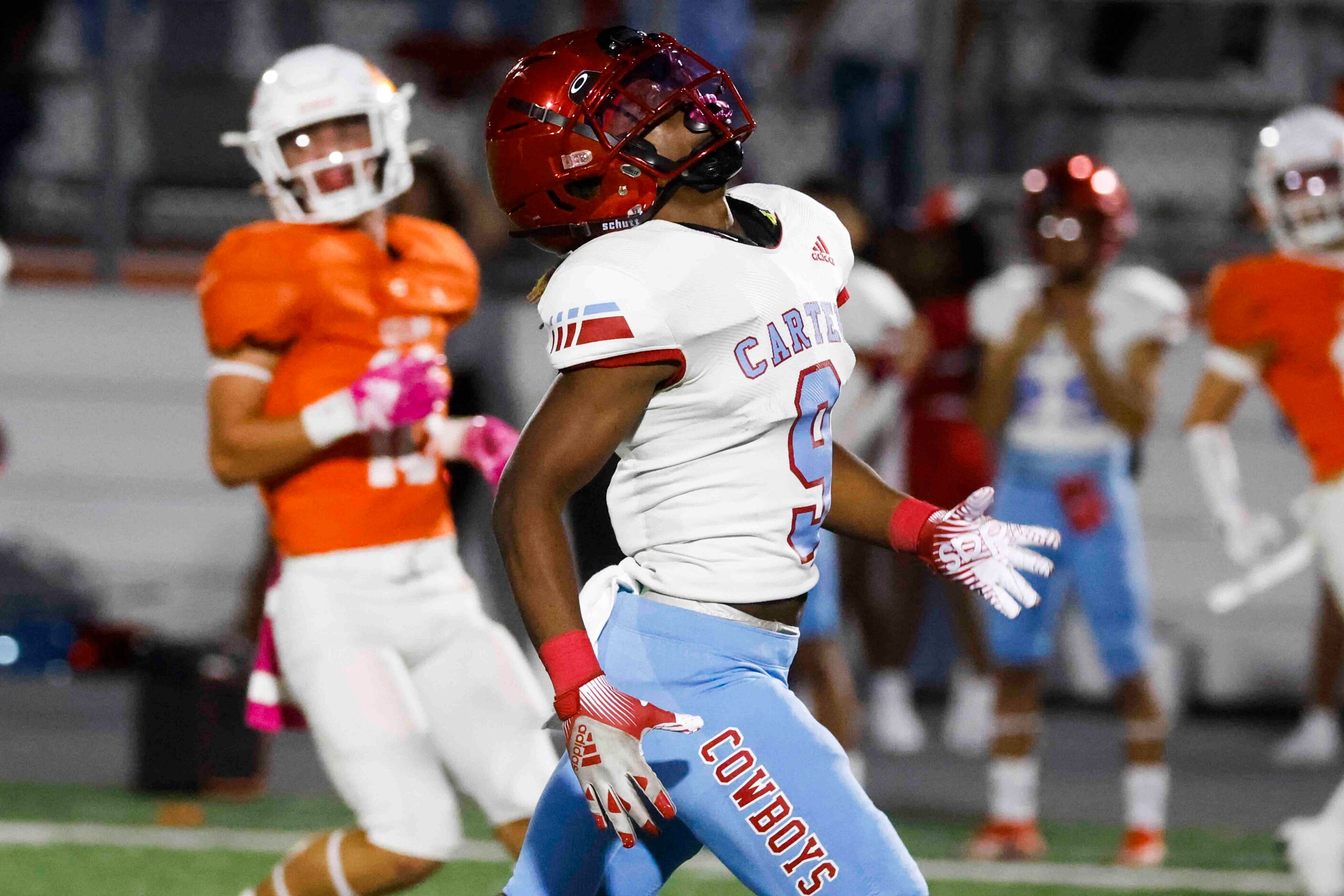 David W. Carter High School’s Khyion Andrews (9) reacts after missing to receive a pass...