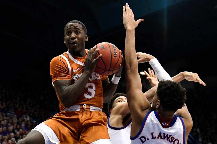 LAWRENCE, KANSAS - JANUARY 14: Courtney Ramey #3 of the Texas Longhorns goes to the basket...