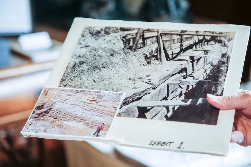 Rockwall County Historical Foundation Museum Curator Carolyn Holt holds up photos that show...