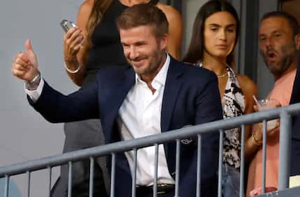 Former European player and Inter Miami’s co-owner David Beckham waves to fans as he settles...