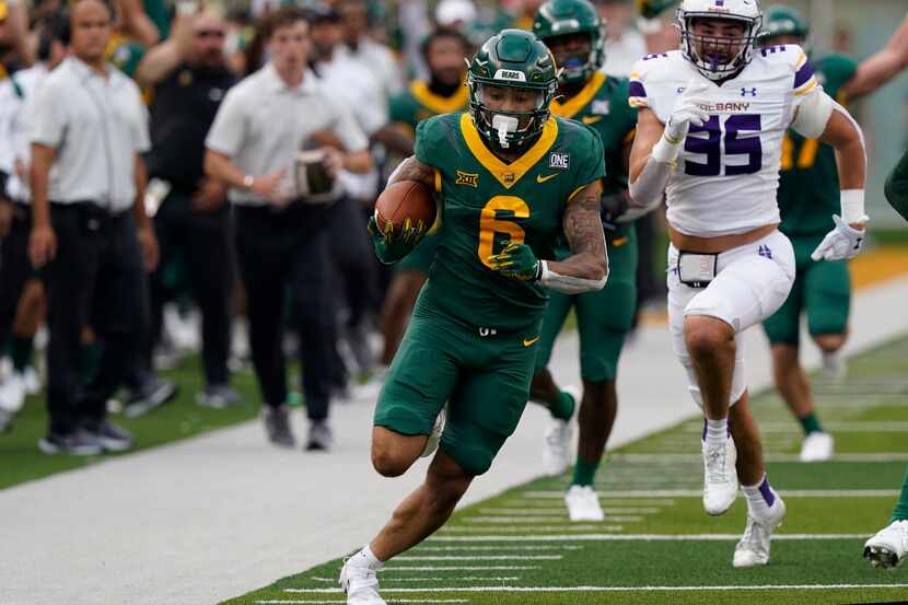 Baylor wide receiver Gavin Holmes (6) breaks away from Albany defensive end Anton Juncaj...