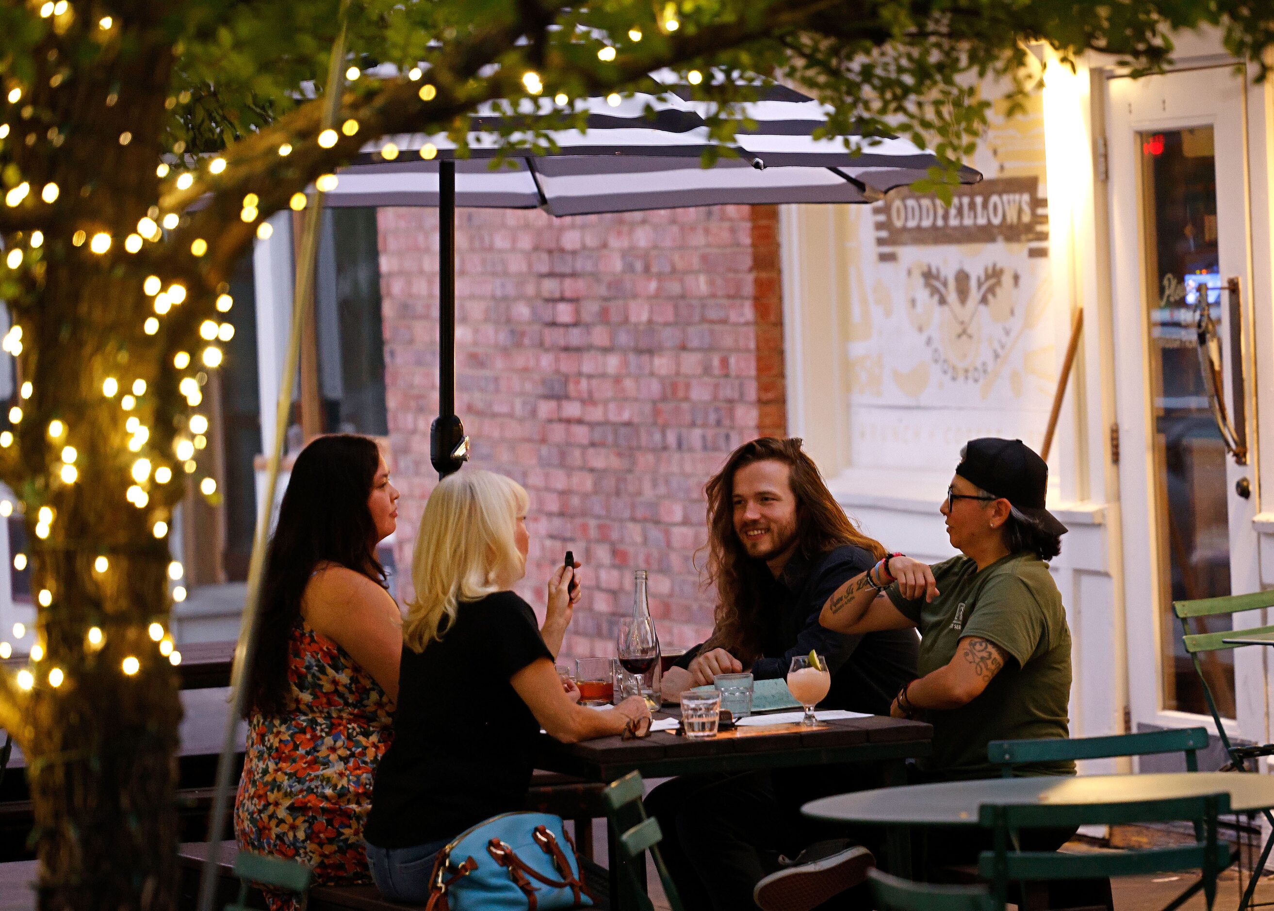 James Maker of Dallas has dinner with his family, clockwise from Maker, Andrea Galindo of...