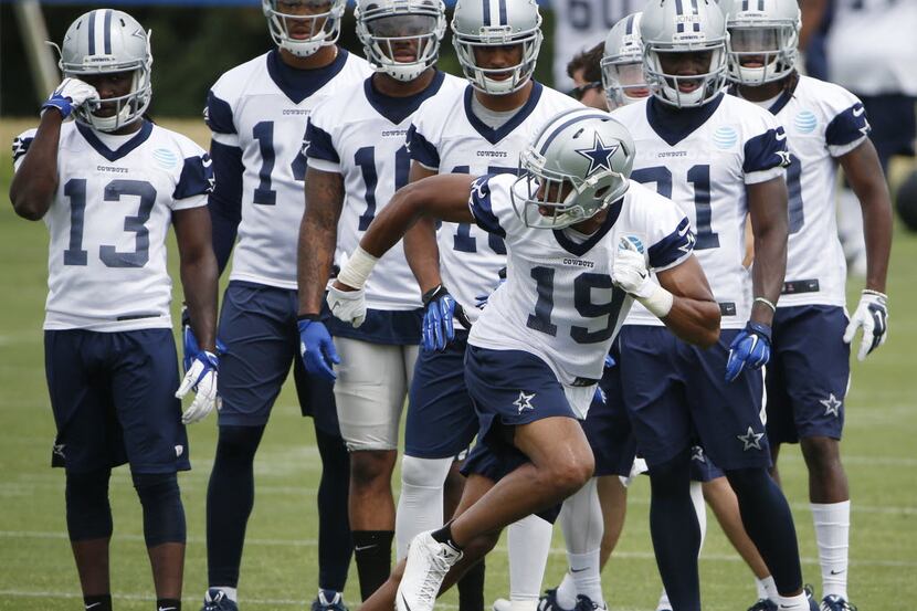 Dallas Cowboys wide receiver Brice Butler (19) runs a drill with teammates nearby during...
